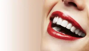 Woman with red lipstick smiling